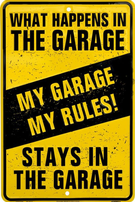 What Happens in the Garage Tin Sign